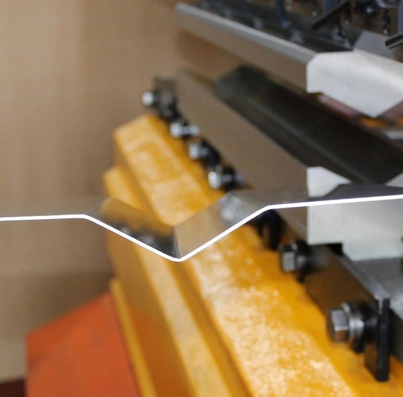 View of the sheet metal sample from the special press brake tool 30.10